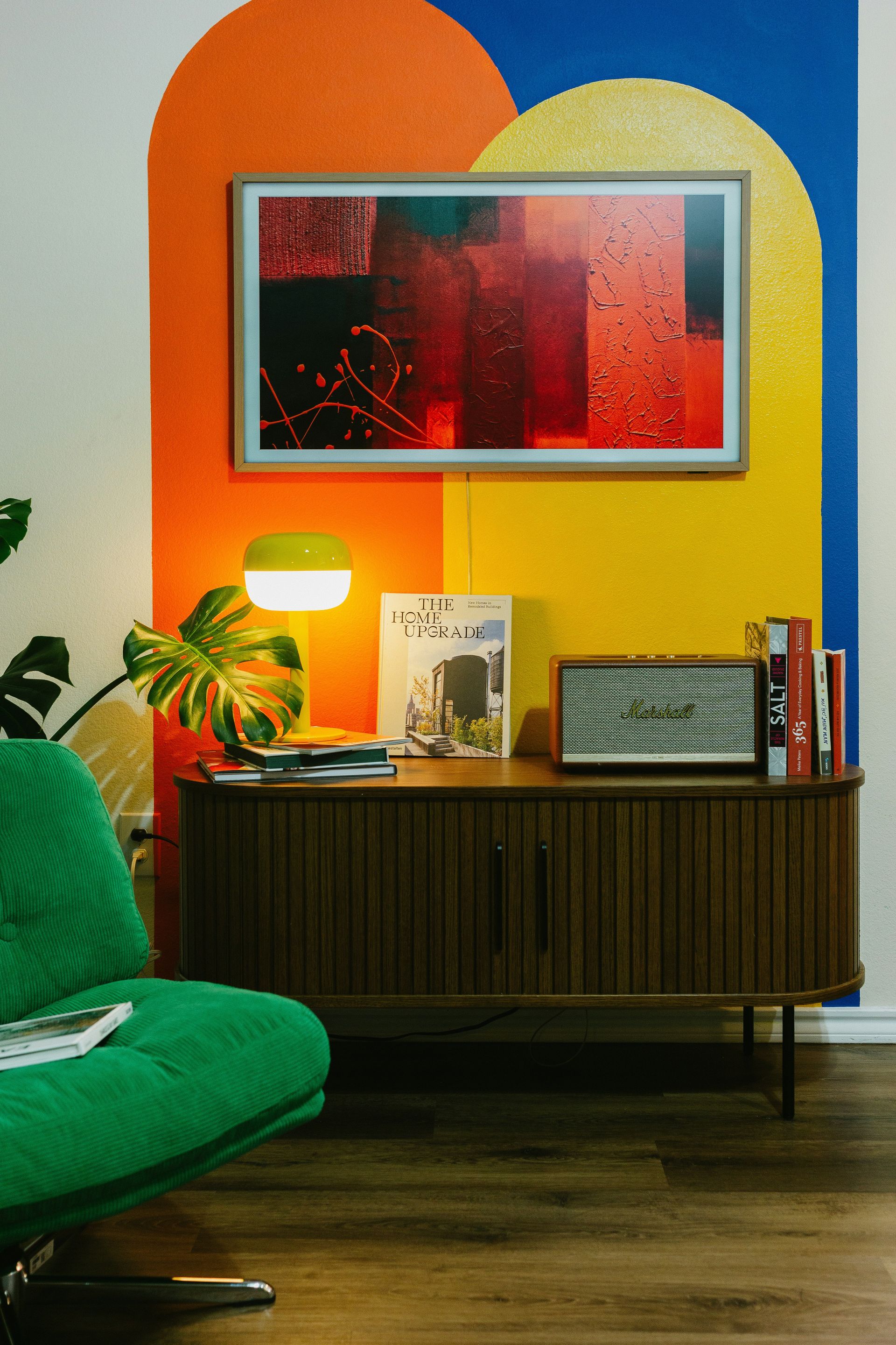 Modern living room with colorful wall art and vintage furniture